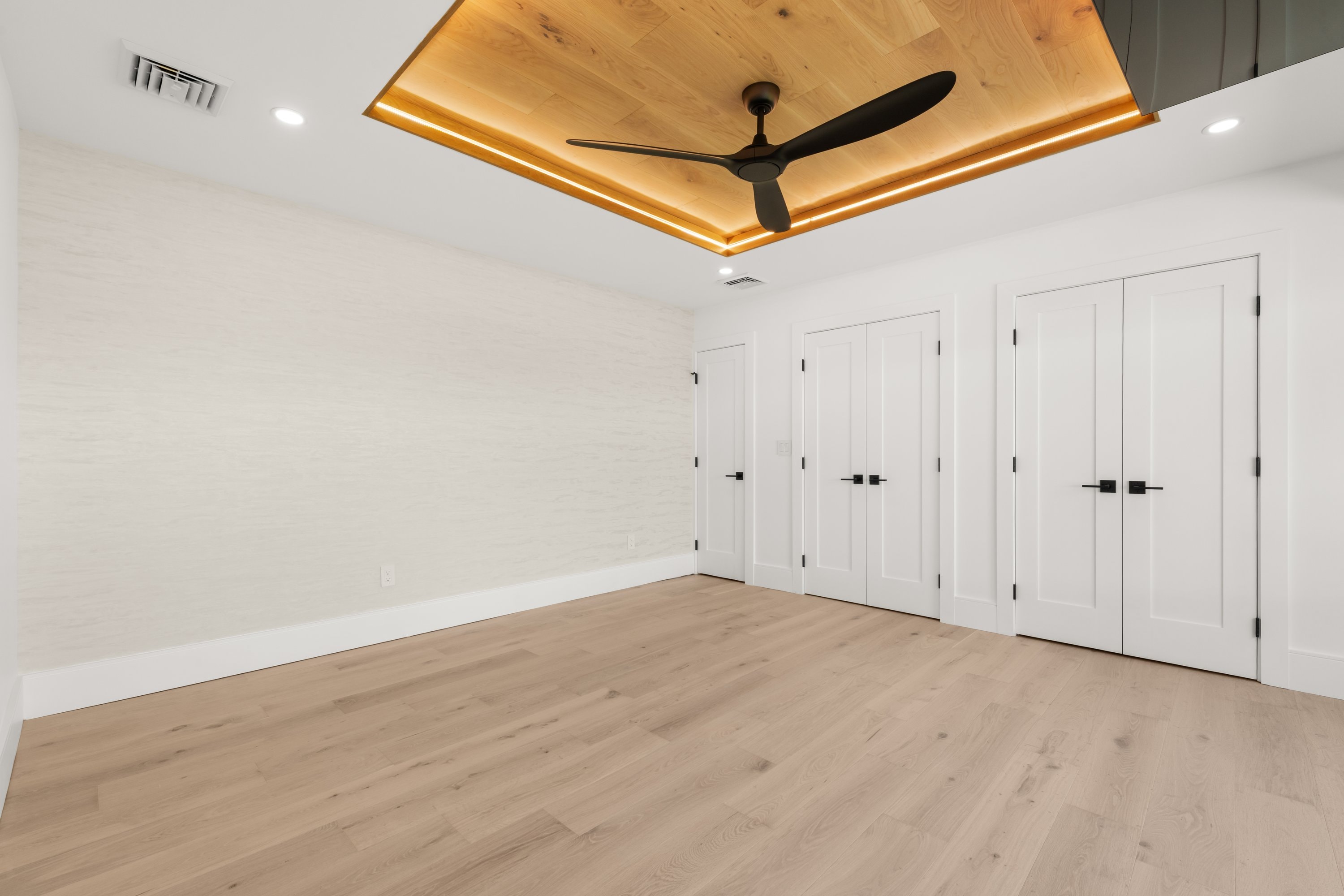 Bedroom with custom wood ceiling